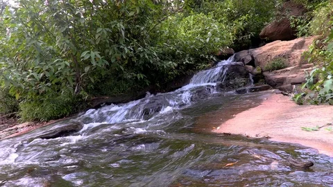 Whitewater flowing over rocks in small river Stock Footage 104767537