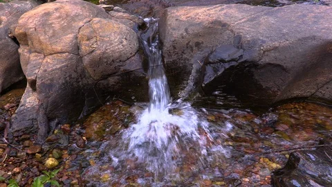 Whitewater flowing over rocks in small river Stock Footage 104767761