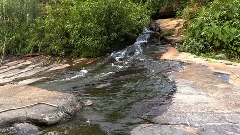 Whitewater flowing over rocks in small river Stock Footage 104768637