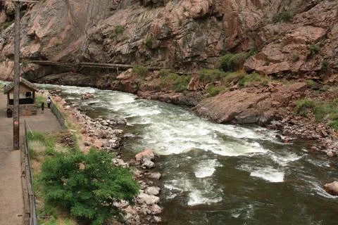 Whitewater Rapids Rushing Through Rugged Mountain Canyon Floor Stock Photos