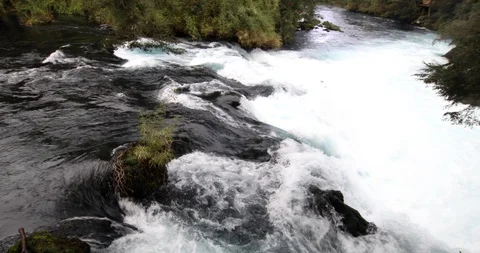 Whitewaters rapids and waterfall inside a green forest scenery at Patagonia Stock-Footage 118009802