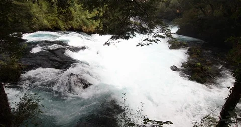 Whitewaters rapids and waterfall inside a green forest scenery at Patagonia Vídeos de archivo 118092487