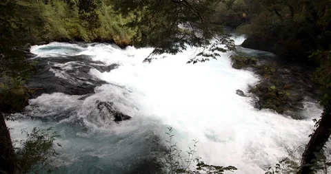 Whitewaters rapids and waterfall inside a green forest scenery at Patagonia Stock-Footage 118096243