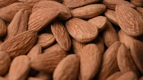 Whole Almond Background Angled Macro Close Up Healthy Food Stock Rotating Video Stock Footage 340752523