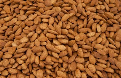 Whole almonds as background Stock Photos
