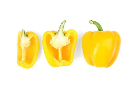 Whole and cut yellow bell peppers isolated on white Stock Photos