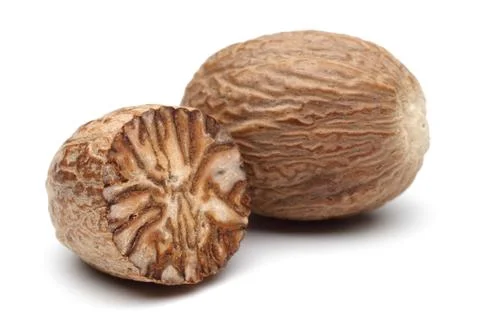 Whole and half Nutmeg Stock Photos