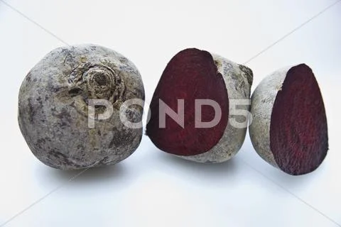 Whole and halved beetroot Stock Photos