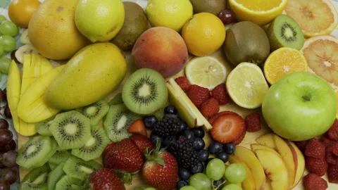 Whole and sliced up fruit clumped together - high shot Stock Footage 341224144