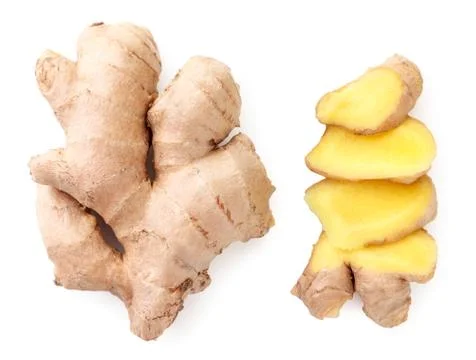 Whole and sliced ginger root on a white background. The view from top Stock Photos