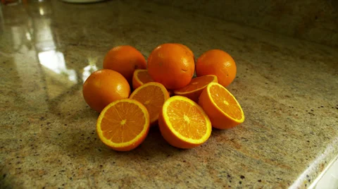 Whole and Sliced Oranges on Counter, Zoom In Stock Footage 35224010