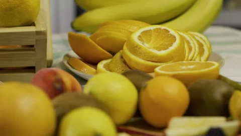 Whole and sliced oranges on kitchen counter - medium shot Stock Footage 341253228