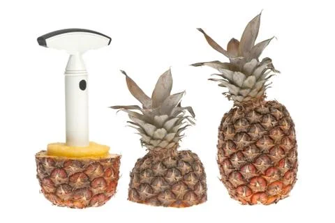 Whole and split pineapple with cutter Stock Photos