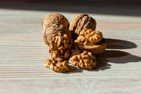 Whole and split walnuts and how light hits Stock Photos