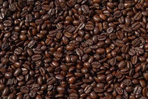 Whole bean coffee background medium roast organic equitable import food bever Stock Photos