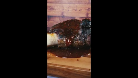 Whole Beef Shin with Bone and Gravy on Board Stock Footage 325116675