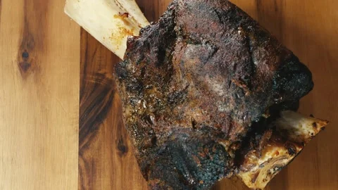 Whole Beef Shin with Bone and Gravy on Board Stock Footage 325116734