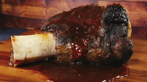 Whole Beef Shin with Bone and Gravy on Board Stock Footage 325116773