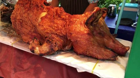 Whole body deep fried crispy pork ribs meat on native market of Thailand Stock Footage 84349825