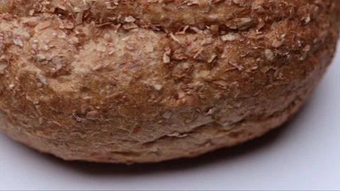 Whole bread bun rotating in macro presentation as seamless loop for food ba.. Stock Footage 323238571