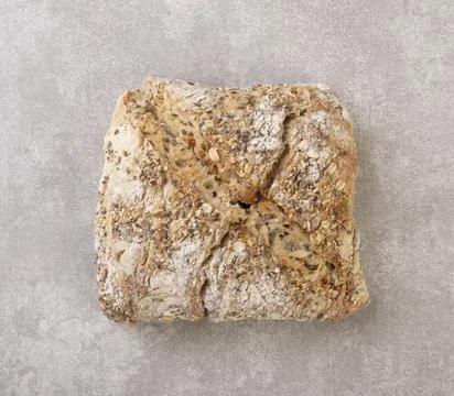 Whole bread over concrete background. Top view Stock Photos