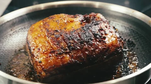 Whole Brisket Searing in Pan Stock Footage 323650256