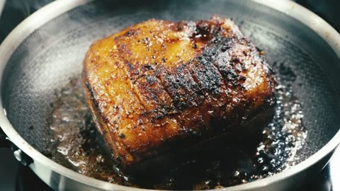 Whole Brisket Searing in Pan Stock Footage 323650272