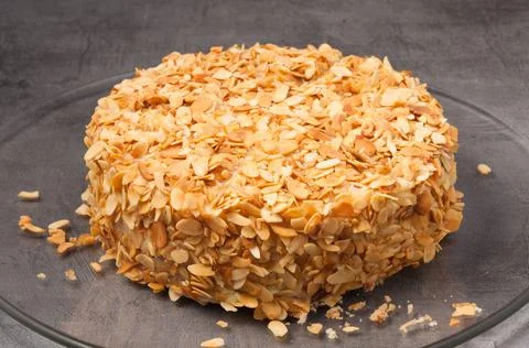 A whole cake with nuts on a gray background Stock Photos