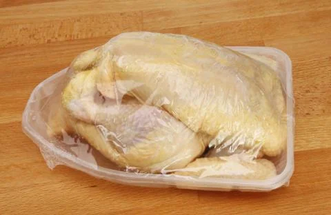 Whole chicken in packaging Stock Photos