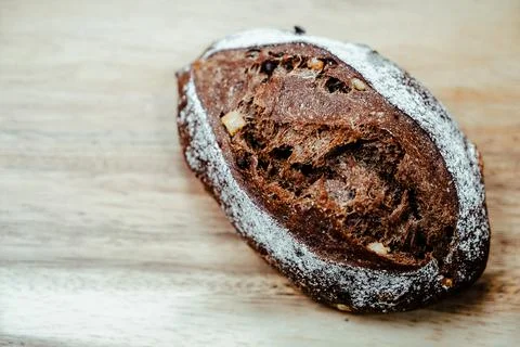 Whole Chocolate Bread with nuts, Artesian Bakery, Breakfast, wood board overlay Stock Photos