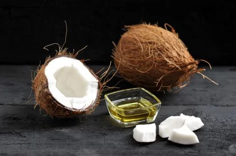 Whole coconut, split coconut and coconut oil Stock Photos
