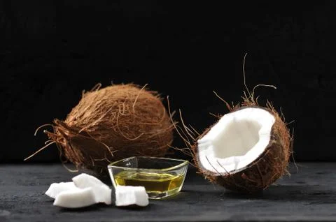 Whole coconut, split coconut and coconut oil Stock Photos