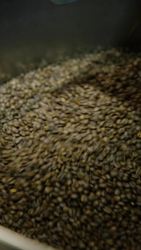 Whole coffee beans roasting vertical video Stock Footage 229350180
