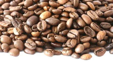 Whole coffee beans on white background Stock Photos