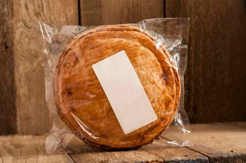 Whole Cooked Pie in Plastic Packaging Stock Photos