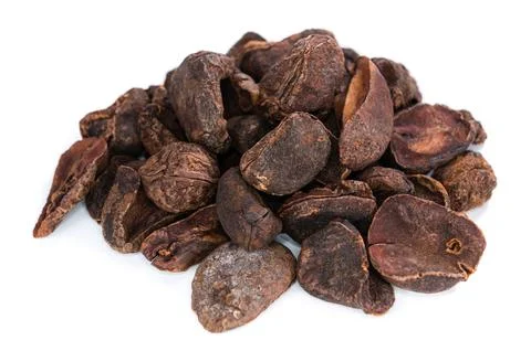 Whole dried Cola Nuts (close-up shot) isolated on white background Stock Photos