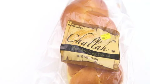 Whole egg braided bread challah packaged in plastic by Trader Joe's Stock Footage 227157730