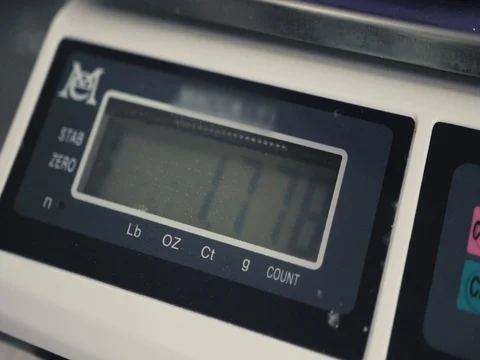 Whole flour in bowl on kitchen scale on bakery products factory close up Stock Footage