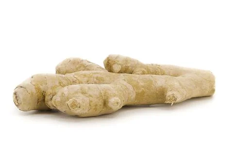 Whole ginger isolated under soft white lighting. Stock Photos