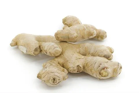 Whole ginger root highlighted on bright white backdrop. Stock Photos