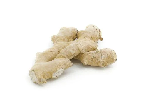 Whole ginger root isolated on clean white, highlighting its rugged and orga.. Stock Photos