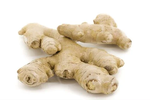 Whole ginger root isolated on a neutral white surface. Stock Photos