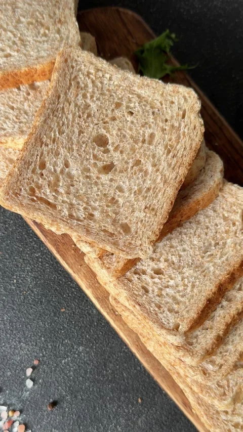 Whole-grain bread fresh baked goods, fluffy bread slices tasty snack Stock Footage 334338389