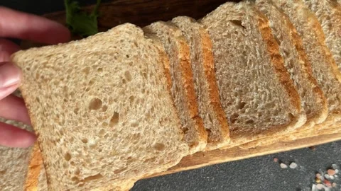 Whole-grain bread fresh baked goods, fluffy bread slices tasty snack Stock Footage 334338390