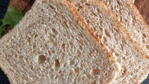Whole-grain bread fresh baked goods, fluffy bread slices tasty snack Stock Footage 334338399