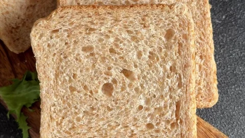 Whole-grain bread fresh baked goods, fluffy bread slices tasty snack Stock Footage 334338402