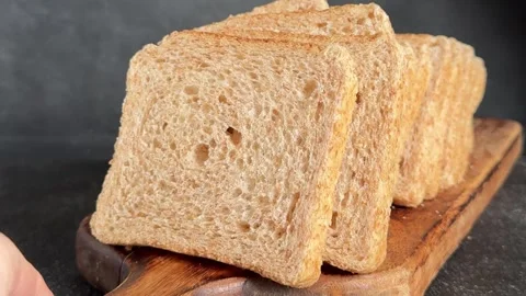 Whole-grain bread fresh baked goods, fluffy bread slices tasty snack Stock Footage 334338428