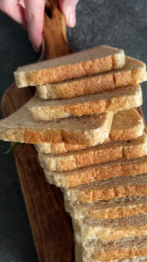 Whole-grain bread fresh baked goods fluffy bread slices tasty snack Stock Footage 335652502