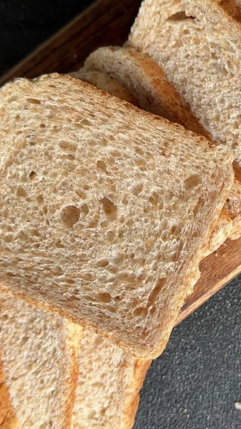 Whole-grain bread fresh baked goods fluffy bread slices tasty snack Stock Footage 335652504