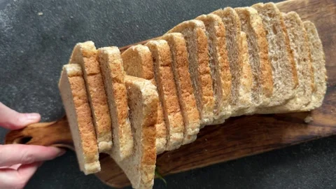 Whole-grain bread fresh baked goods fluffy bread slices tasty snack Stock Footage 335652505